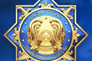 После долгого пребывания на Балканах в Казахстан под арестом возвращен предполагаемый 
мошенник
